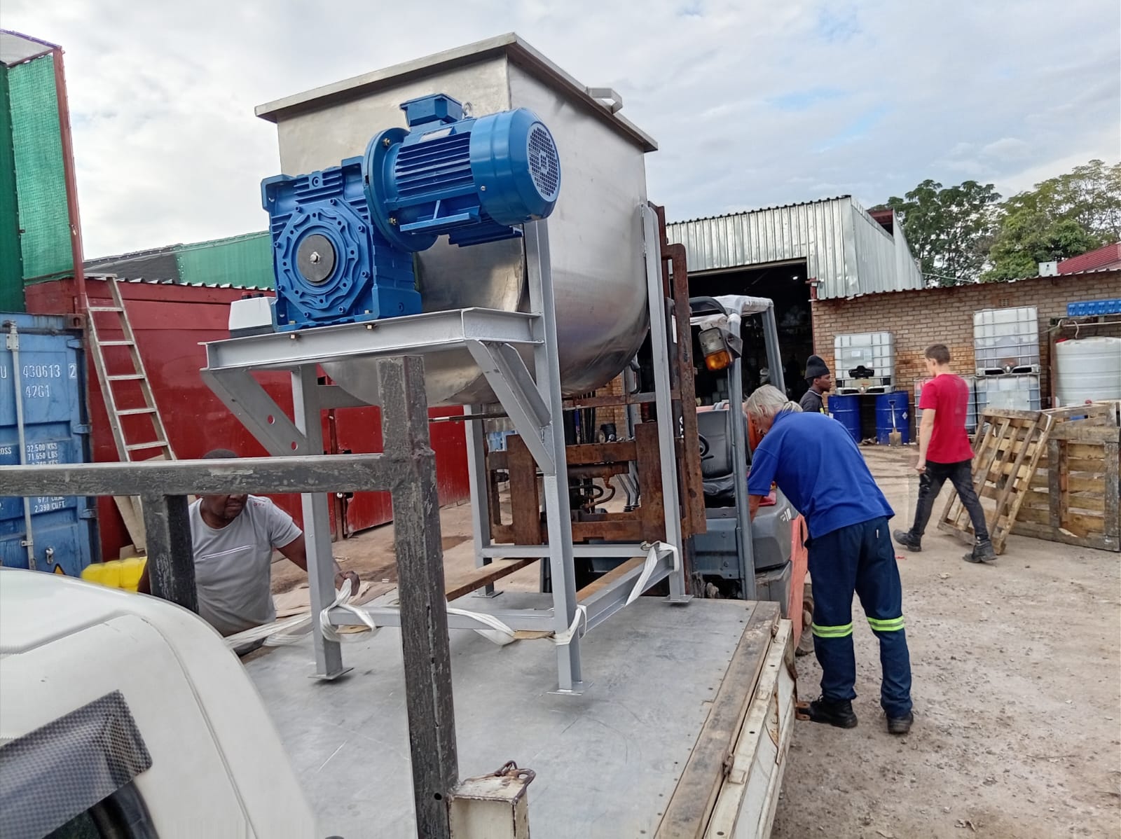 Larger capacity SME Machinery ribbon blender mixer being loaded onto a delivery truck