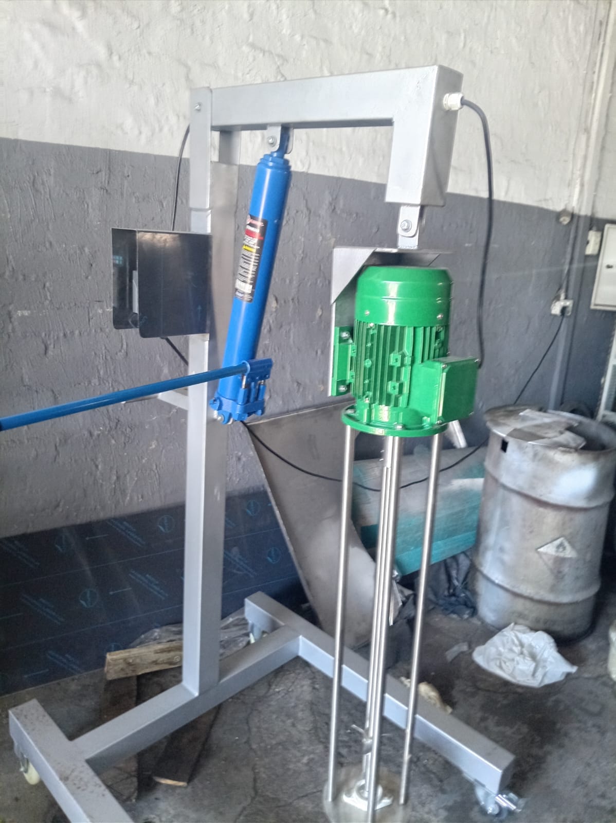 Close view of a Silverson-type homogenizer mixer's mixing head and motor