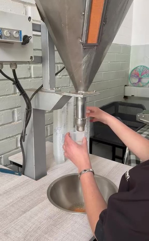 SME Machinery semi-automatic powder filling machine dosing spice powder into a cup