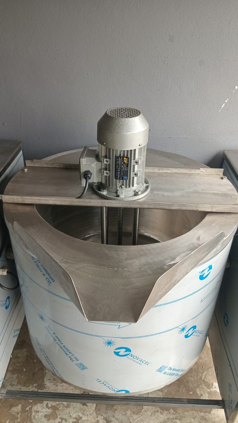 Stainless steel jacketed tilting pot with top-mounted motor and agitator